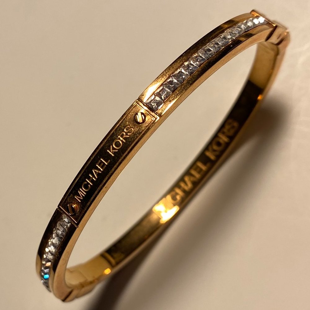 Michael Kors Women’s Gold Tone Hinged Bangle Bracelet with Crystal Accents